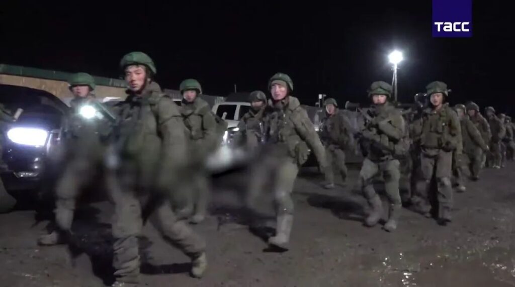 North Koreans march with Russian flags through Pyongyang as Ukraine counts 6,000 of their dead in Kursk